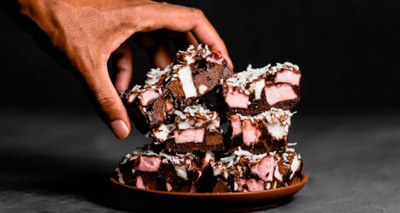 Hand grabbing a keto rocky road bars