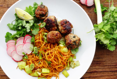Paleo meatballs with sweet potato noodles on white plate