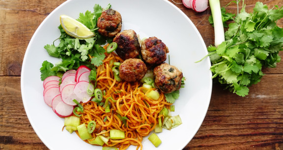 Paleo meatballs with sweet potato noodles on white plate
