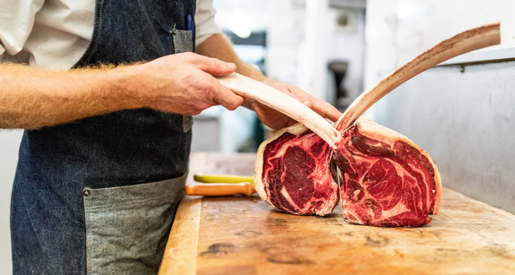 Butcher preparing red meat