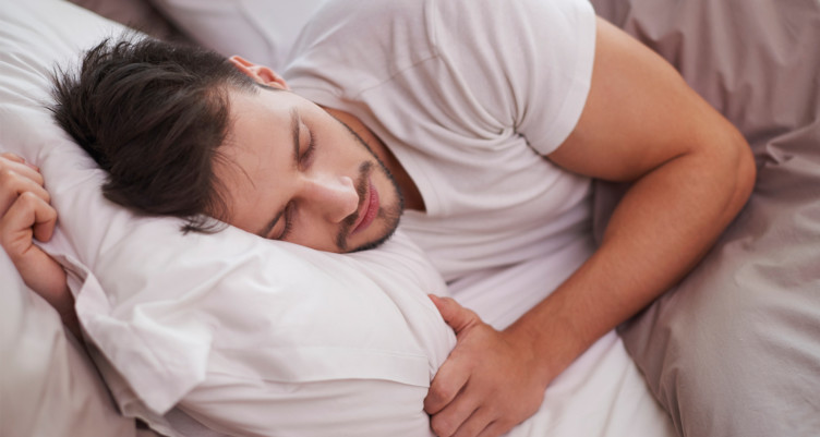 Man sleeping in bed