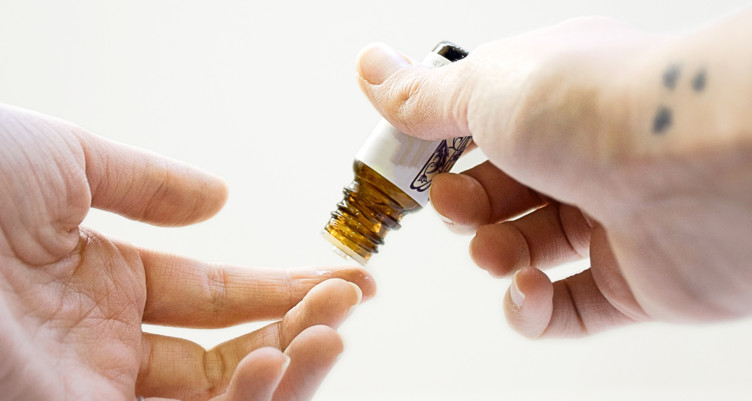 Essential oil on fingertip