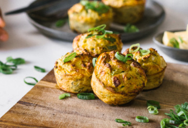 Bacon and zucchini muffins on cutting board