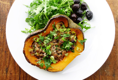 This stuffed acorn squash recipe is packed with flavor and nutrients, thanks to a savory blend of pork, bacon, and herbs stuffed right into the squash.