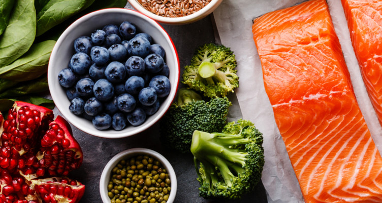 Blueberries, salmon and broccoli on table