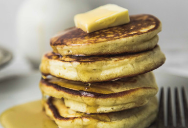 Gluten-free pancakes with butter and syrup
