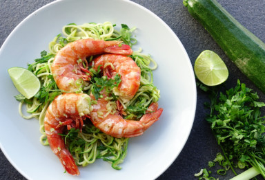 Three jumbo shrimp on zucchini noodles with lime