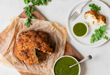 Whole roasted cauliflower with chimichurri sauce