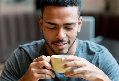 Man sipping coffee