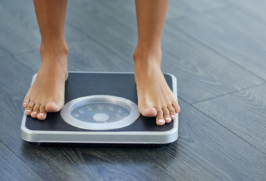 woman standing on scale