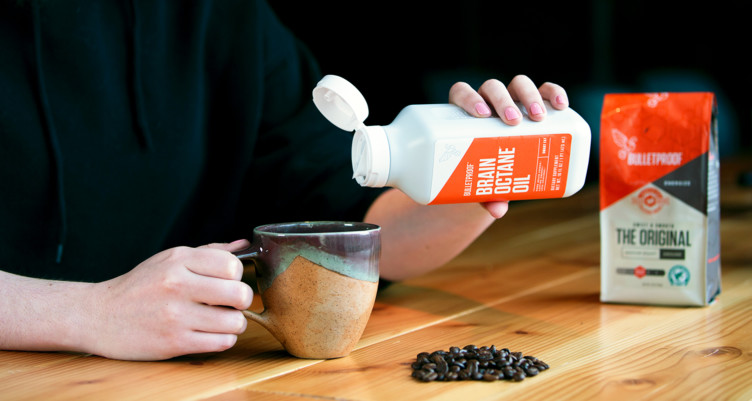 Pouring Brain Octane oil into coffee
