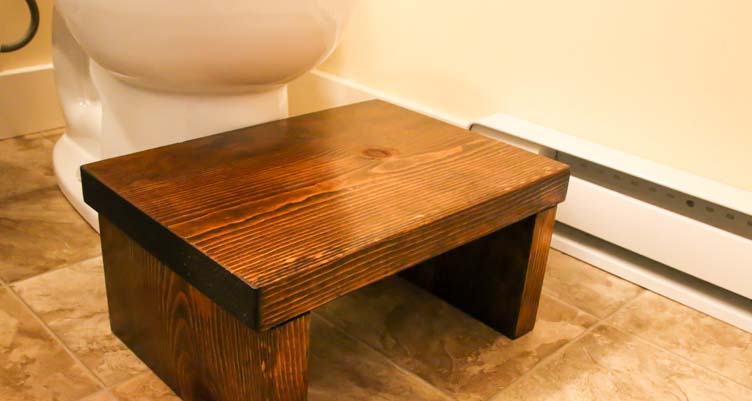 squatty potty squat stool in bathroom