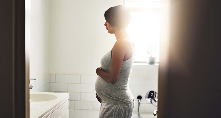 pregnant woman in bathroom