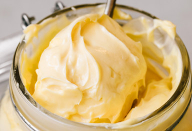 An open container of fresh butter