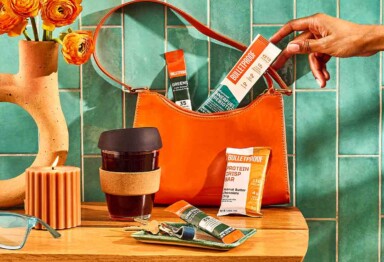 Bulletproof travel products in orange purse