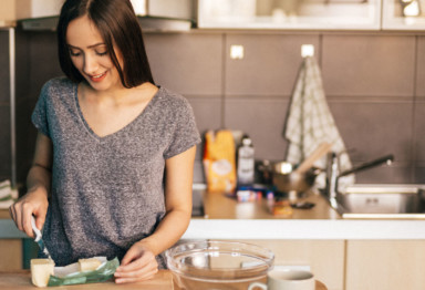 Woman cooking in her kitchen