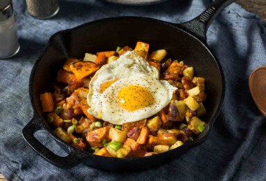 Paleo Sweet Potato Hash Recipe With Bacon in a cast iron pan