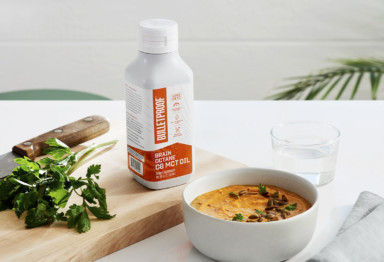Bulletproof Brain Octane C8 MCT Oil next to a bowl of soup