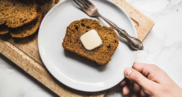 Paleo pumpkin bread with butter
