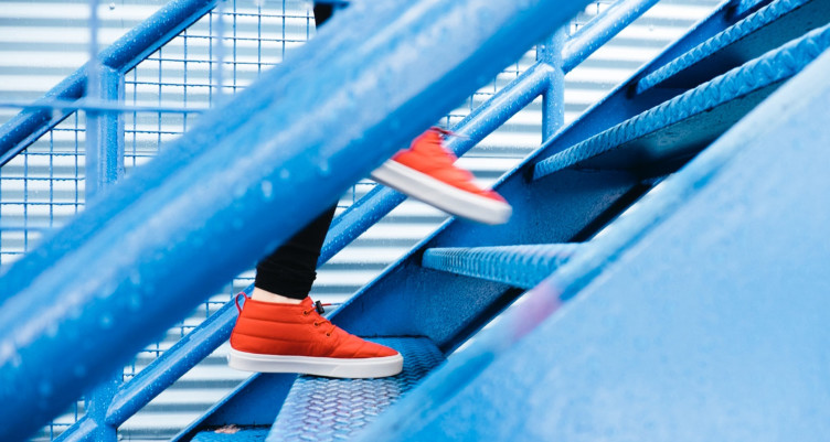 Person jogging up stairs