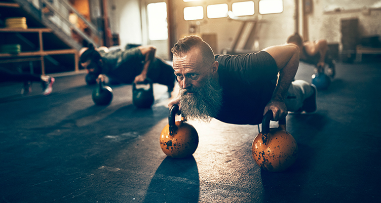 Man working out with kettlebells