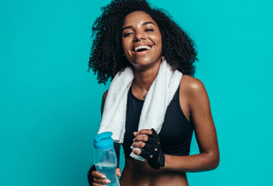 Fit woman in front of blue background