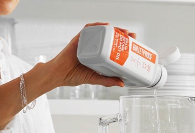 Pouring Bulletproof Brain Octane C8 MCT Oil into blender