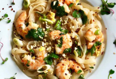 Low-carb shrimp pad Thai on white plate