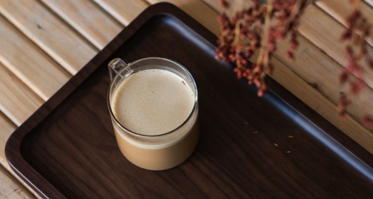 Cup of Bulletproof Coffee on tray