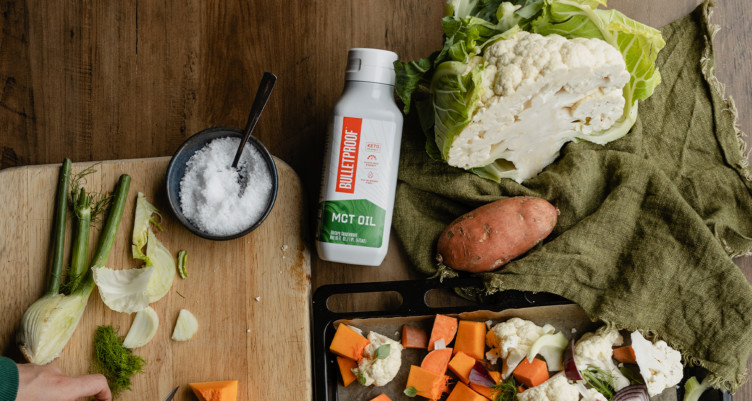 MCT oil on table with vegetables