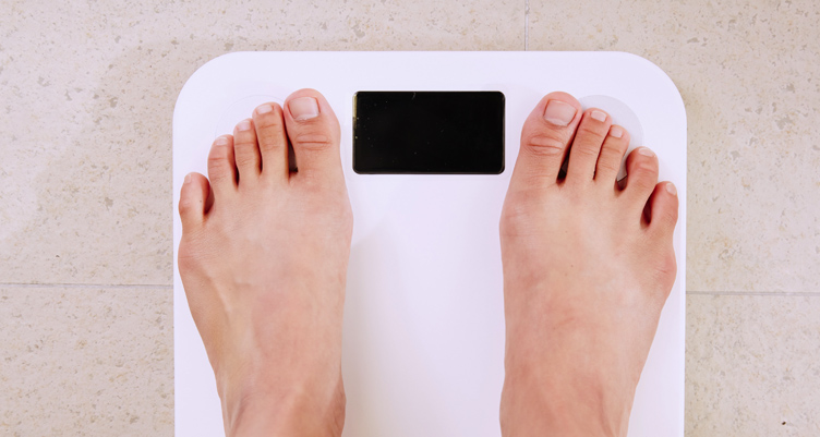 Person stepping on scale