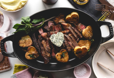 Sliced steak with potatoes and butter