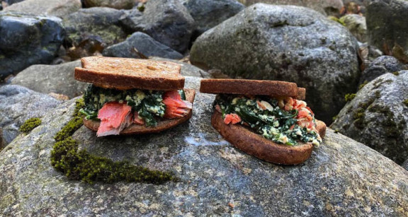 Smoked salmon breakfast sandwiches on rock
