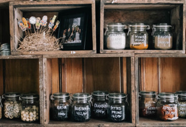 Shelves in pantry with glass jars