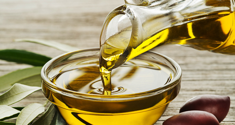 Pouring oil into bowl