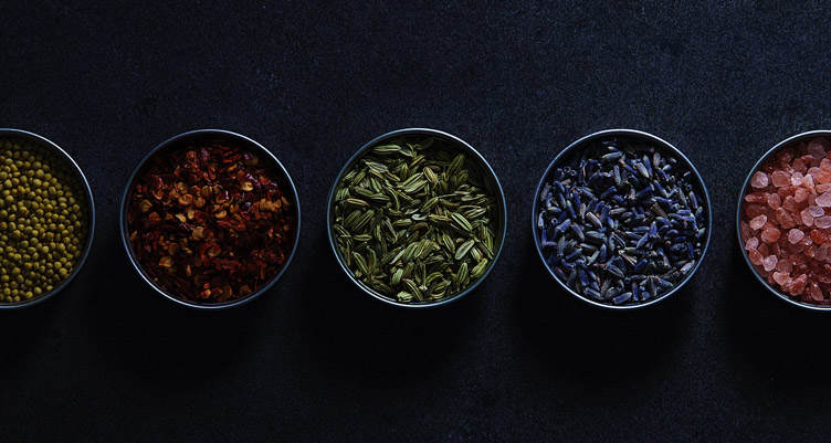 Row of spices in bowls