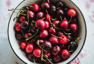 Bowl of cherries on tablecloth