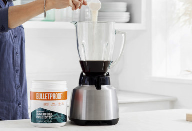 Adding Bulletproof InnerFuel Prebiotic to a blender of coffee