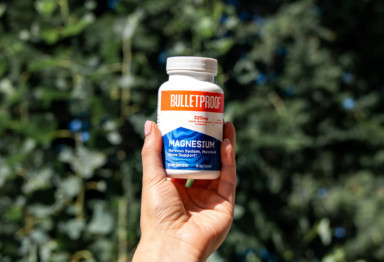 Holding a bottle of Bulletproof Magnesium