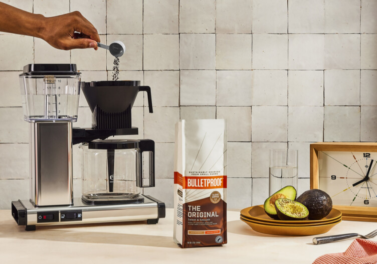 Bulletproof Coffee bag next to a Moccamaster Coffee Maker