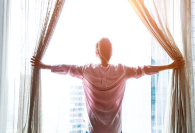 Person looking out window