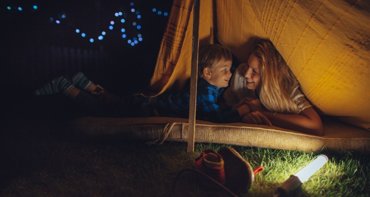 Mom and child camping outside
