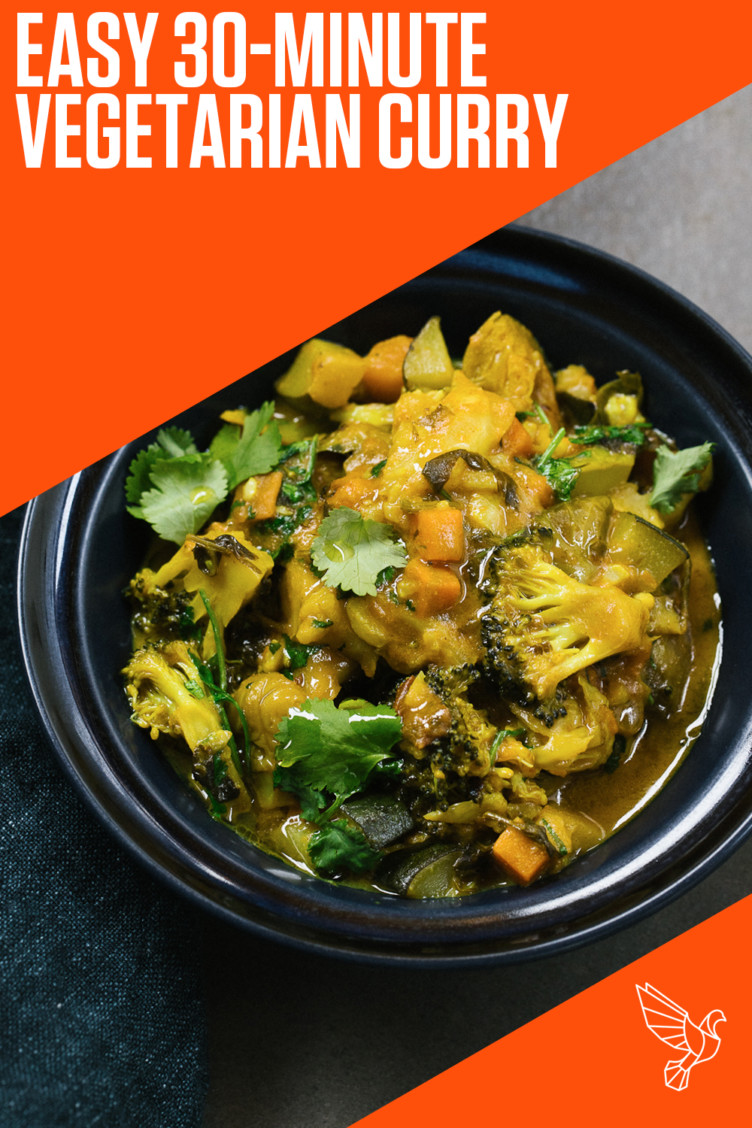 Vegetarian curry in black bowl