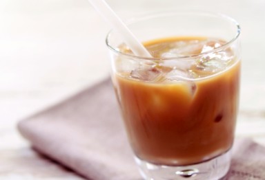 Glass of iced coffee on napkin