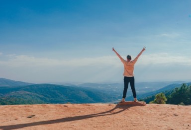 Person standing in sunshine outside