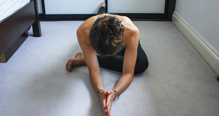 Woman performing pigeon pose