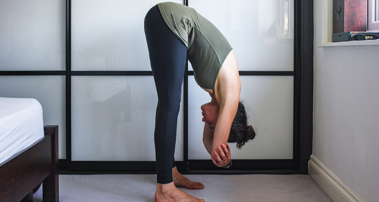 Woman performing a forward fold