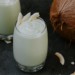Paleo coconut avocado smoothie next to coconut