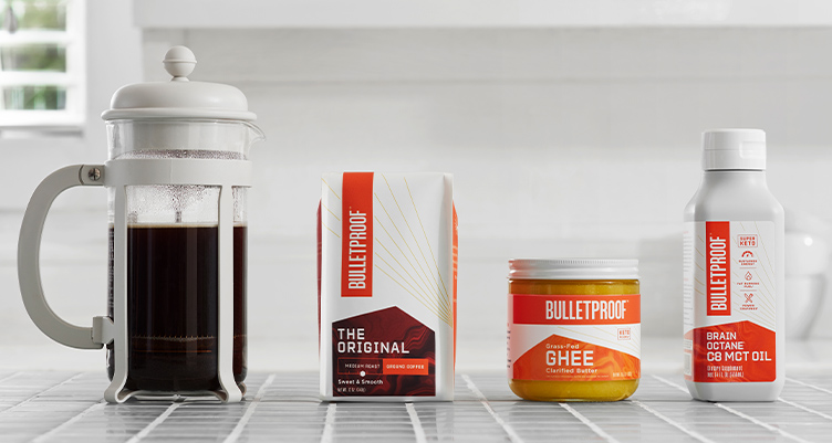 Bulletproof Coffee ingredients next to French press