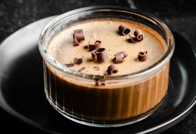 Bowl of coffee panna cotta tops with chocolate shavings